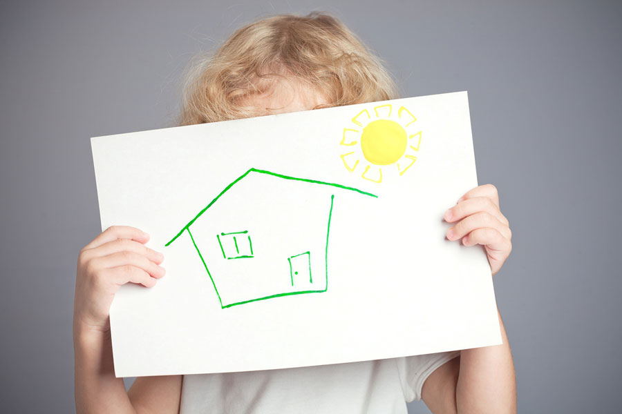 Why Green Houses Are in Demand. Drawn sun and house in baby hands