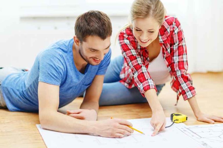 Refinance-to-Renovate Refinance to Renovate a man and a woman on floor looking at blueprints