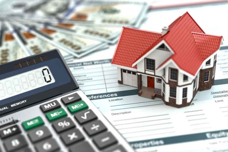 Mortgage-Interest-Rates Mortgage Interest Rates mortgage calculator next to a model hows and money on a financial sheet