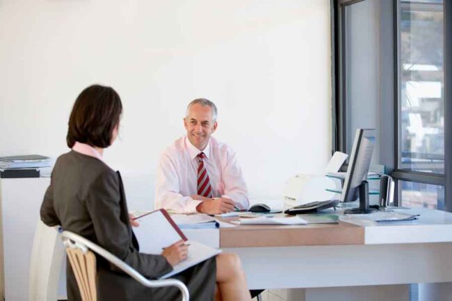 realtor-lender relationship business man and woman in a meeting