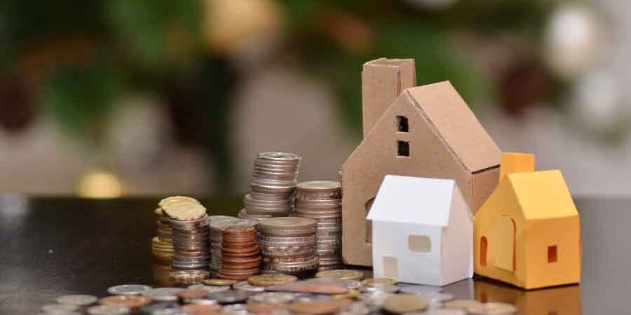 closing-costs-vs-prepaid-fees Paper house and stacks of coins standing, Closing Costs vs Prepaid Fees