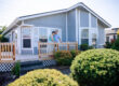 Couple on the porch of their manufactured home