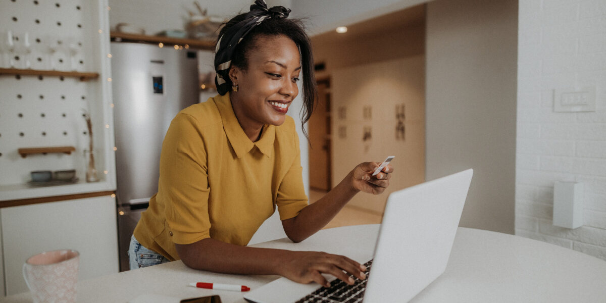 Woman with credit card trying to improve credit score before buying a home
