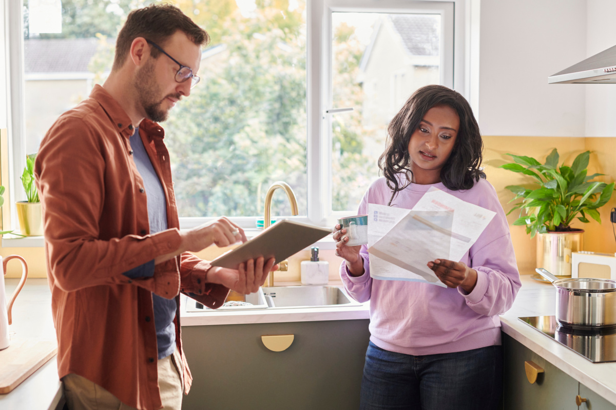 Millenial couple looking at mortgage options and home-buying options