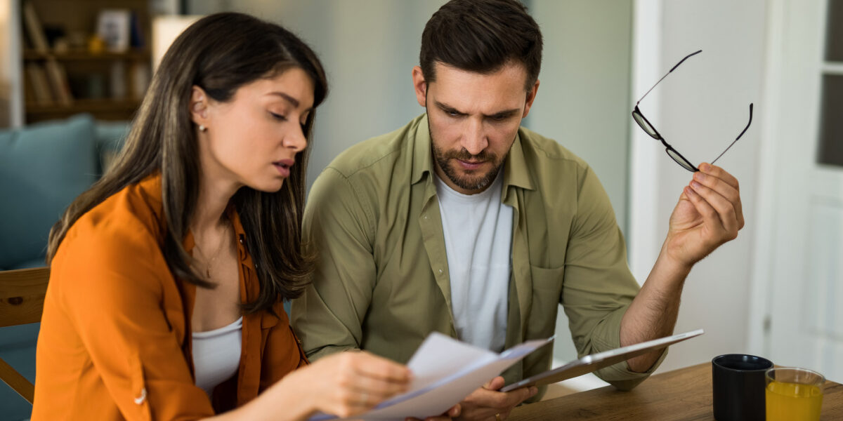 7-reasons-your-mortgage-application-denied-what-to-do-next Couple looking over denied mortgage application