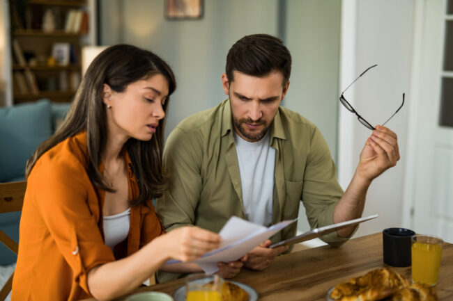 Couple looking over denied mortgage application