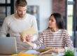 Young couple reading new assessed value for property