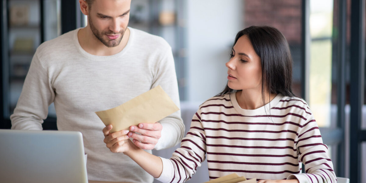 Young couple reading new assessed value for property