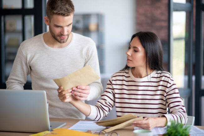 Young couple reading new assessed value for property